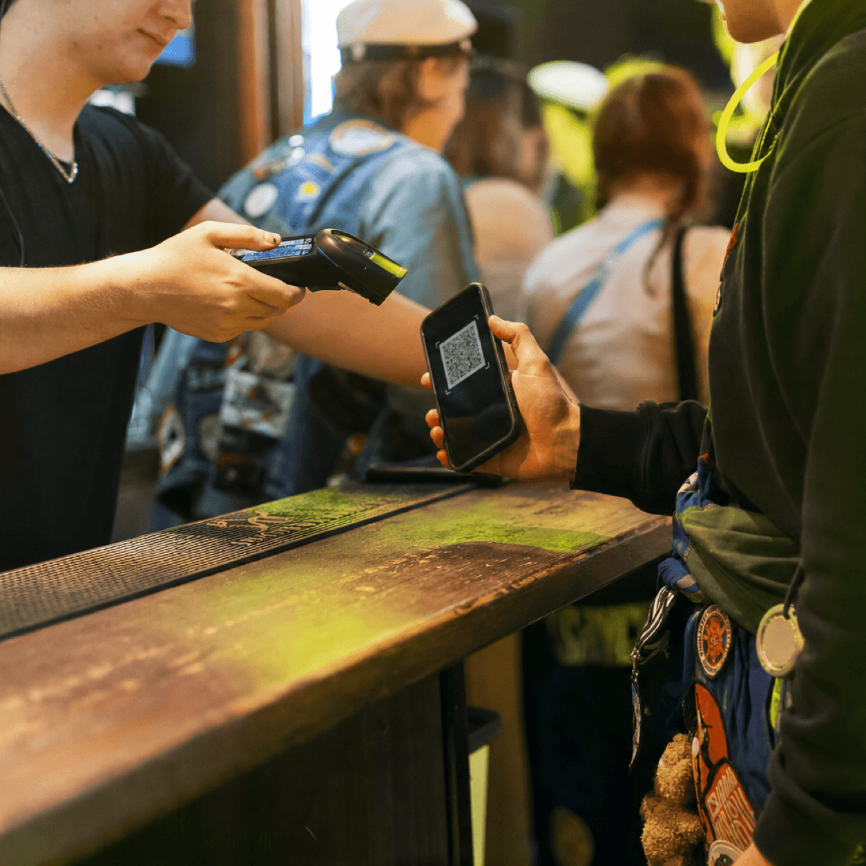 QR scanning at the venue counter during a student event night.